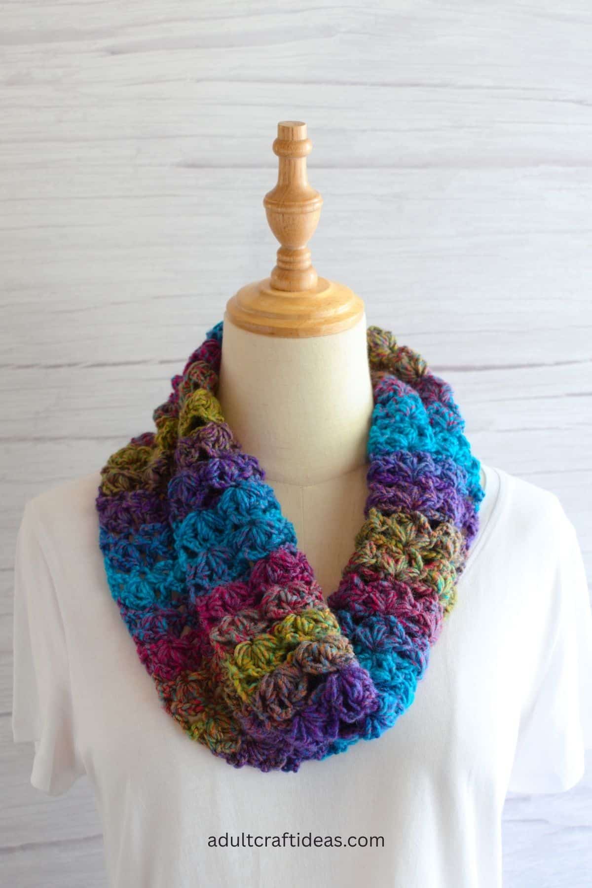 Crochet cowl on a manequine.